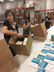 Residents packing boxes for Hand of Hope Prison Ministry
